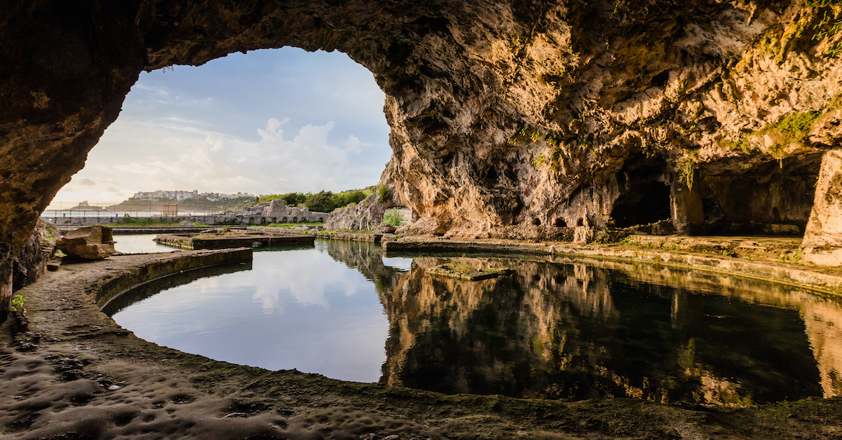 Inside of the cave in the Villa of Tiberius looking out toward the town of Sperlonga in the distance