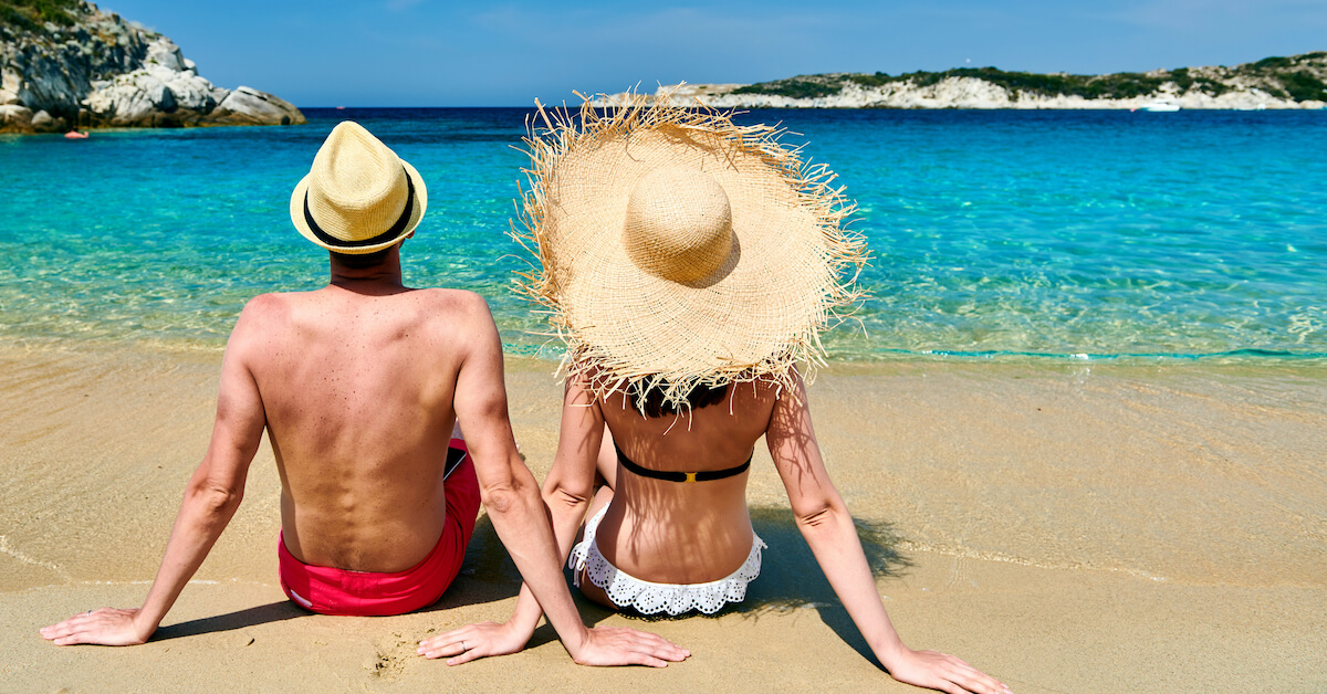 A couple sitting on a beach